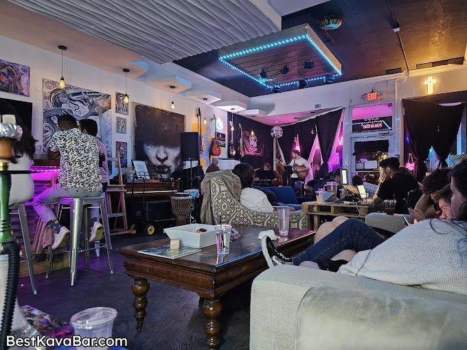 Guests relaxing and enjoying live music in a kava bar lounge